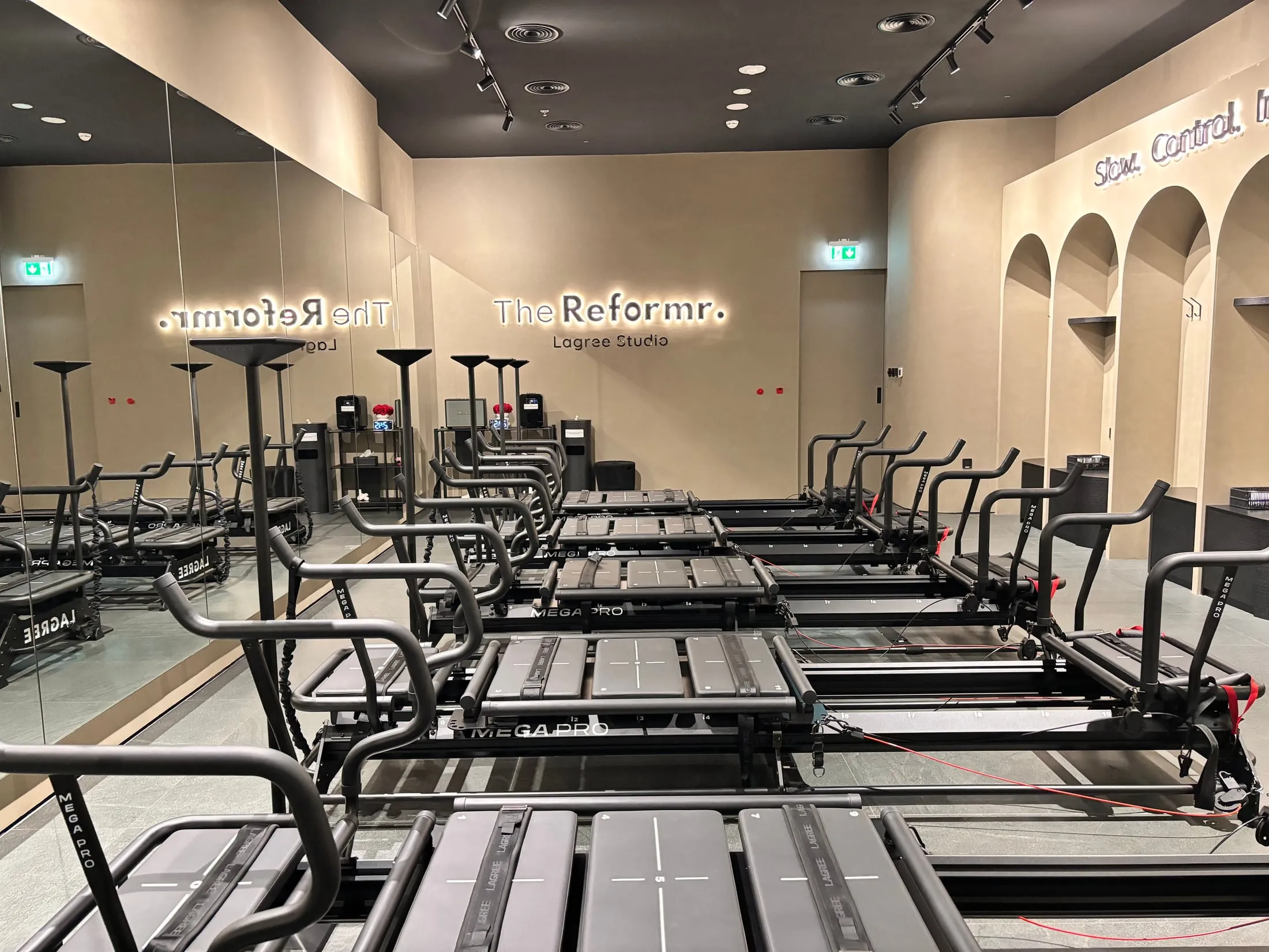 The Reformr. Lagree Studio sign above rows of Megaformers at Abu Dhabi Mall