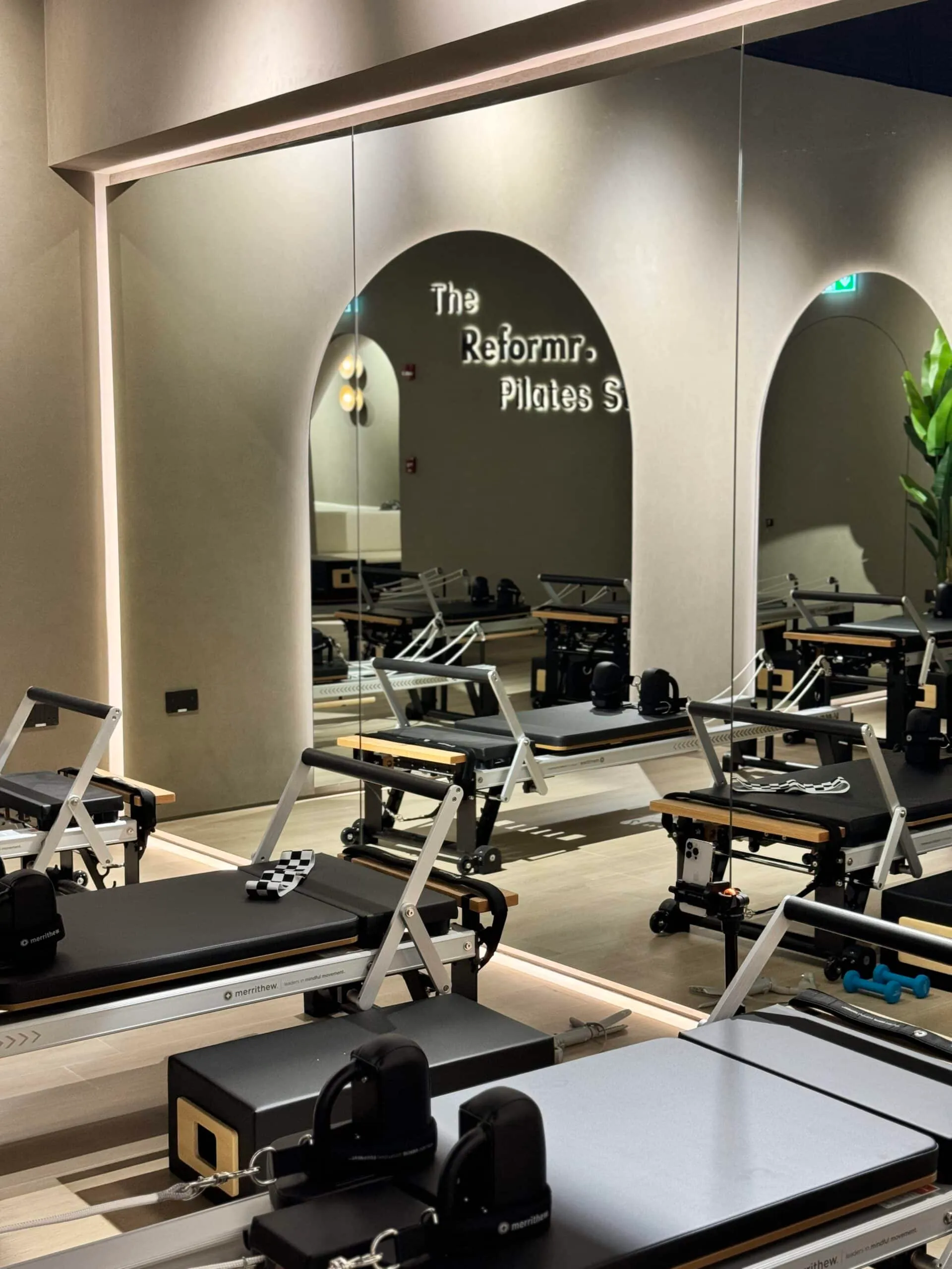 The Reformr. Pilates Studio sign and reformers at Shams Boutik