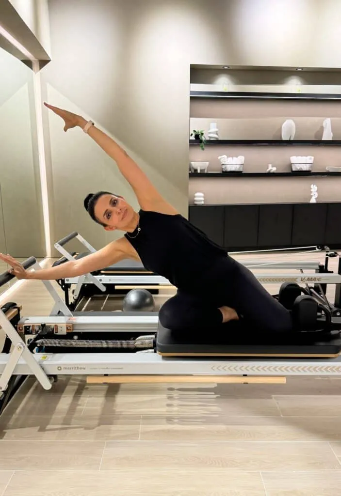 Side stretch on the reformer at The Reformr Pilates Studio