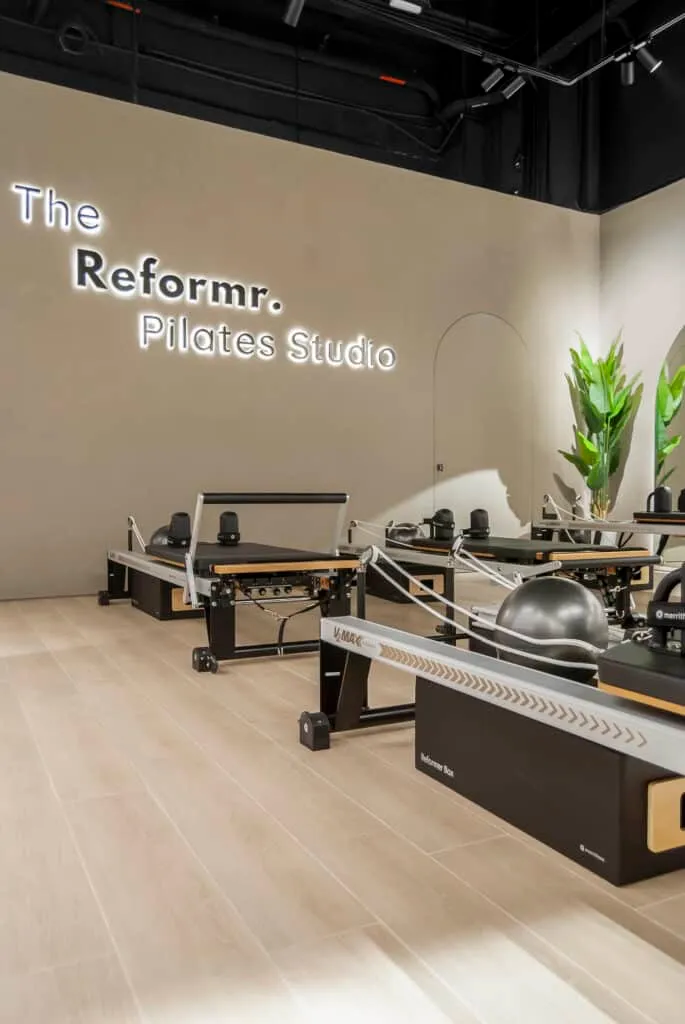 The Reformr. Pilates Studio logo on the arched wall at Shams Boutik