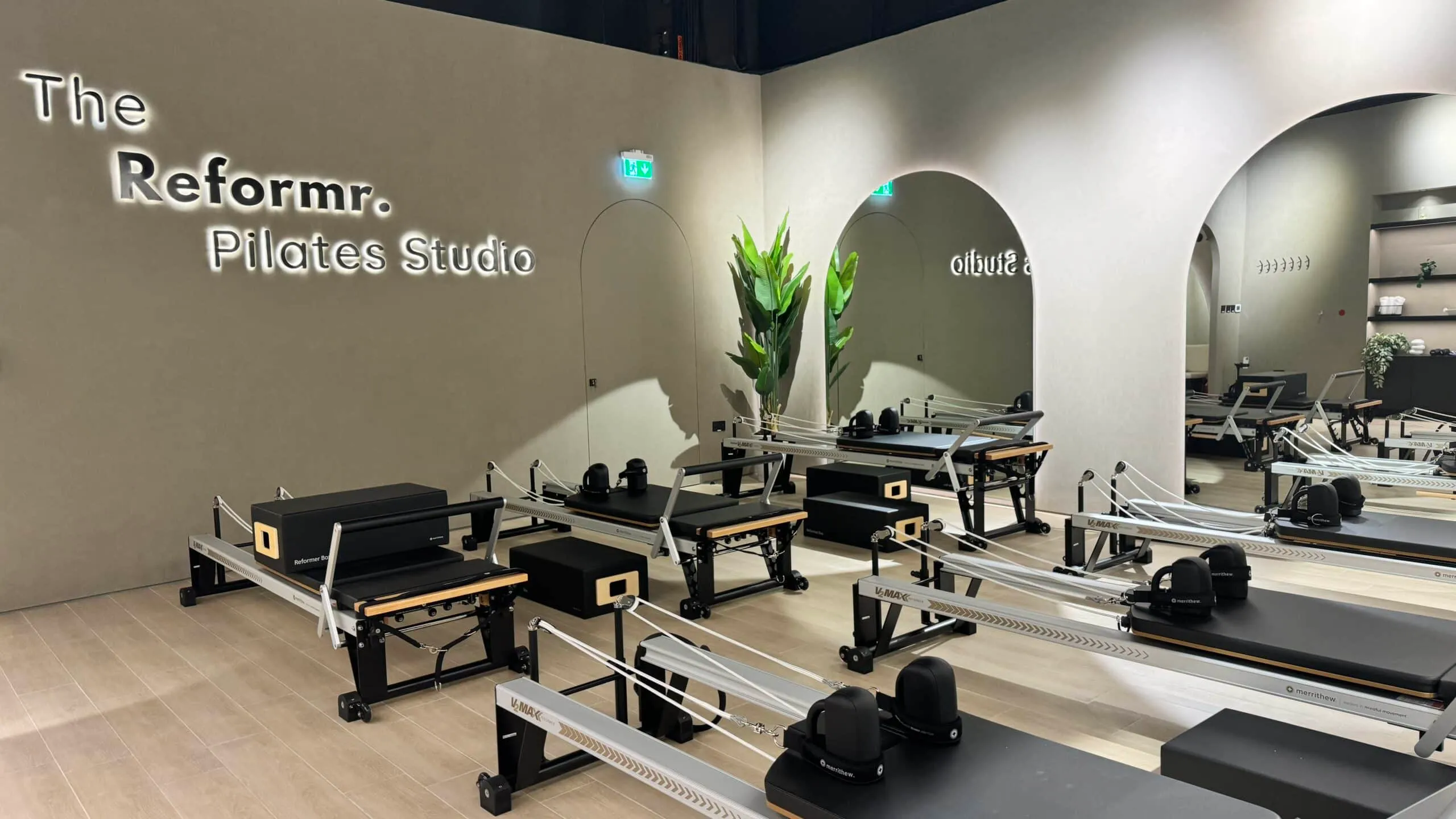 The Reformr. Pilates Studio signage and arches at Shams Boutik